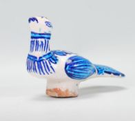 A retro mid 20th Century Italian pottery bird having hand painted blue and white decoration.