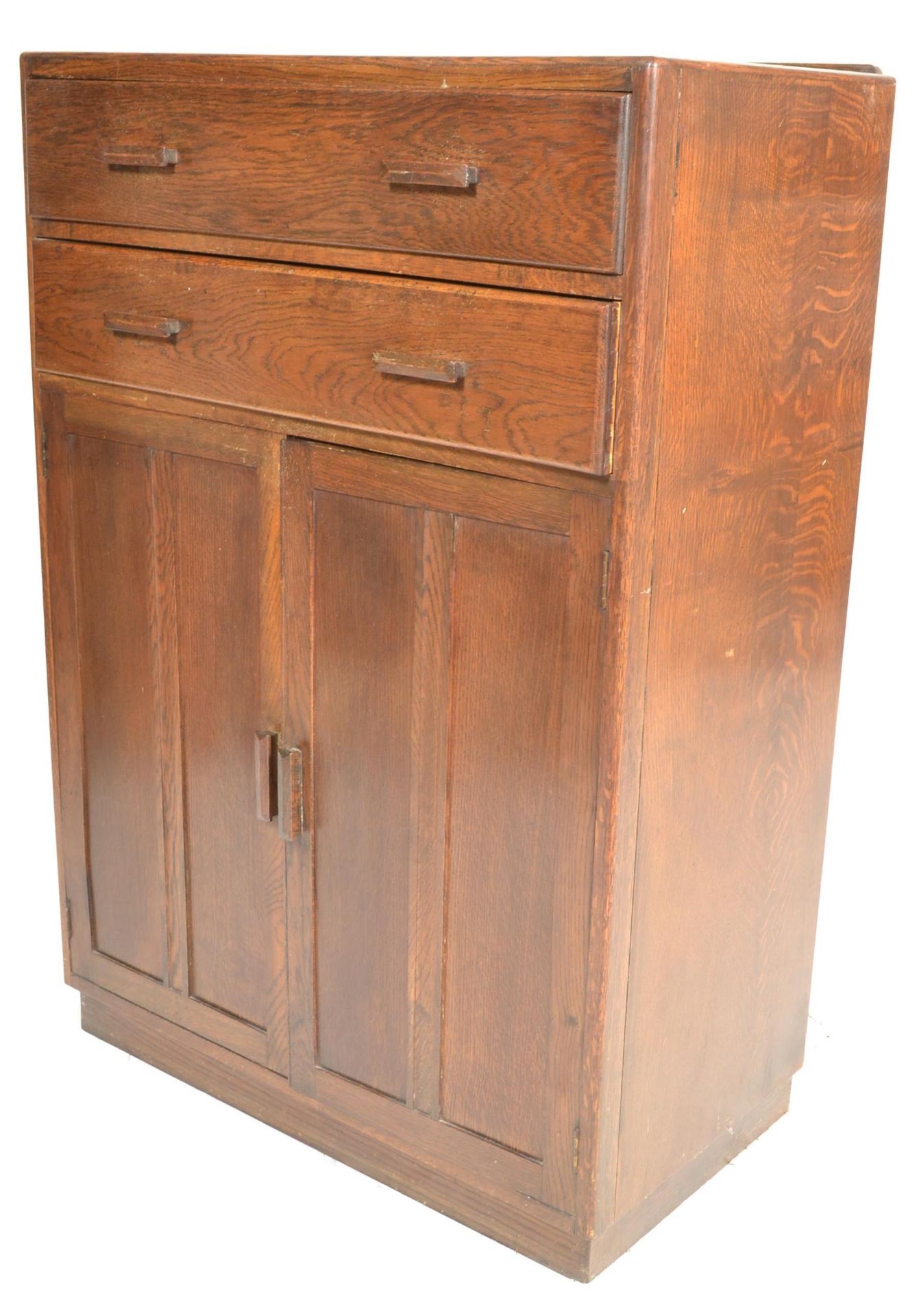 A mid century circa 1940's oak tallboy raised on a plinth base with twin cupboard and two drawers - Bild 6 aus 6
