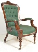 A good quality Victorian 19th century library armchair being raised on turned tapering legs with
