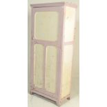 A retro mid century upright painted larder kitchen cupboard. Raised on squared legs with a full