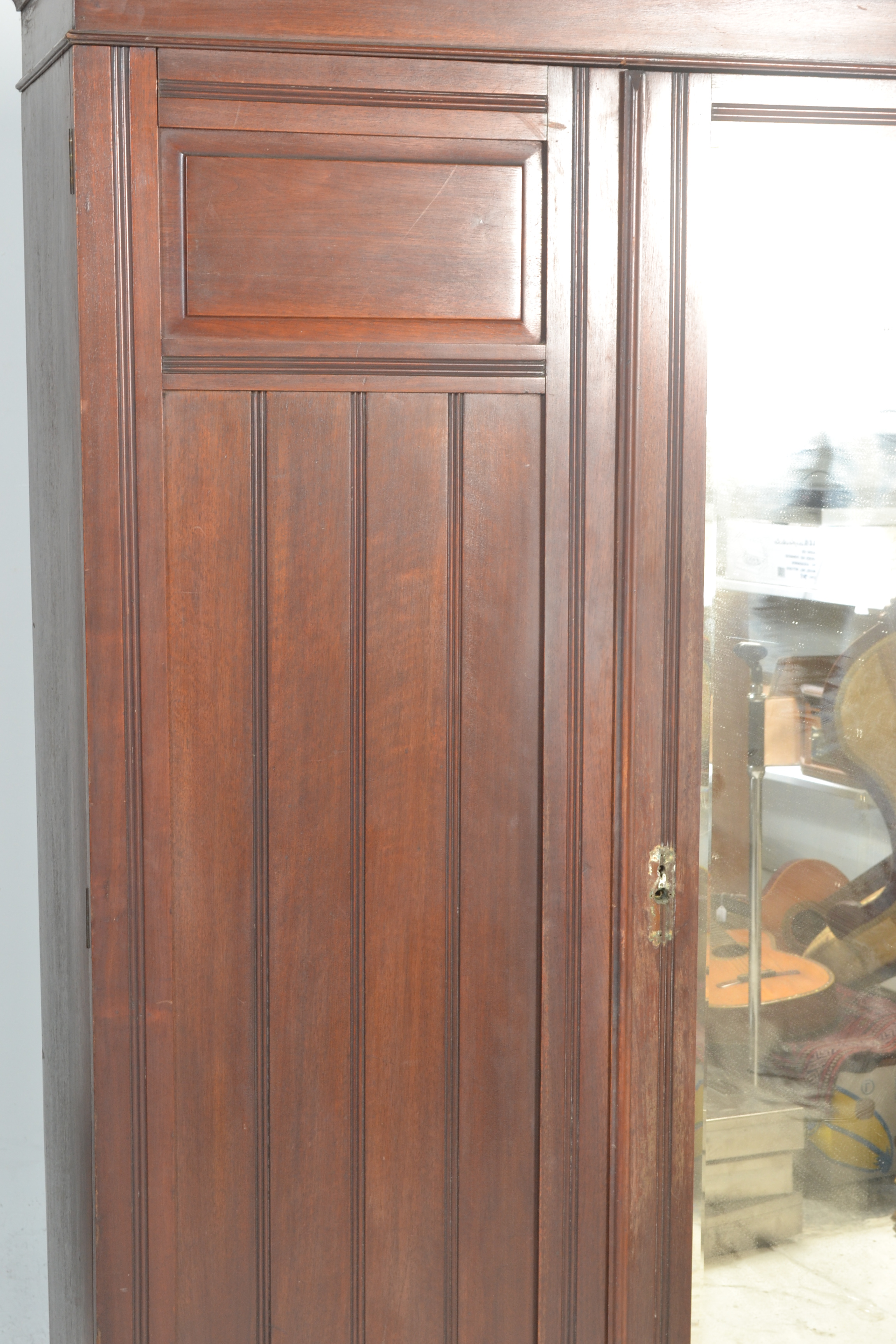 An early 20th Century Edwardian oak triple wardrobe with a central mirrored door flanked by panel - Image 3 of 5