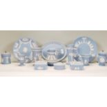 A collection of Wedgwood blue and white jasperware / cameo ceramics to include vases, jug, trinket