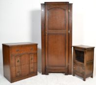A mid century 1940's oak upright hall cupboard / wardrobe with full length fielded panel door