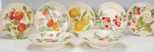 A set of vintage 20th Century French K&G St Clement plates each having raised decoration depicting