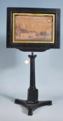 A Victorian 19th century ebonised table top menu holder - pictorial stand. Trefoil base with
