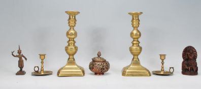 A collection of items to include a pair of 19th century brass candlesticks, pair of Indian brass