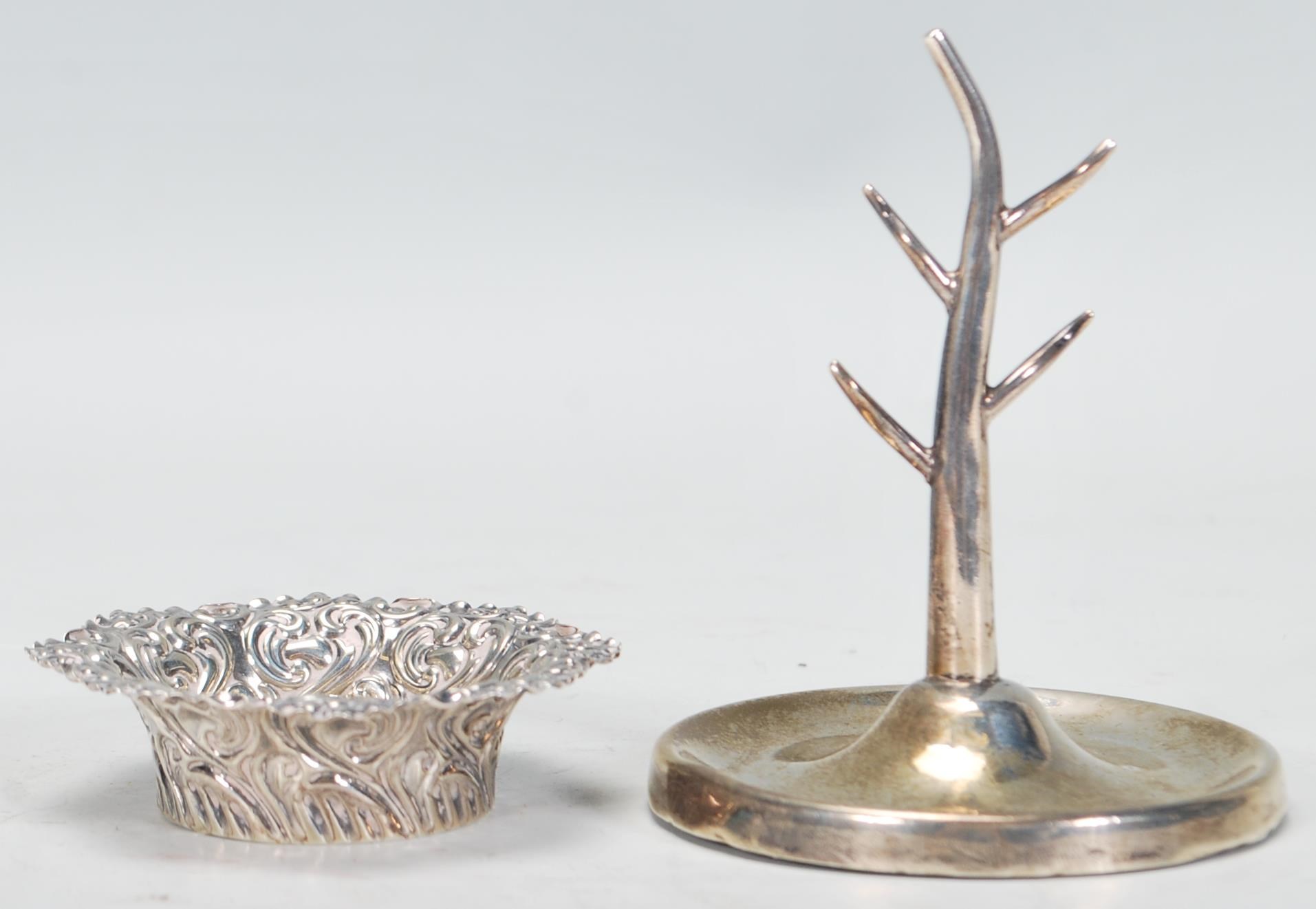A silver hallmarked William Aitkin ring stand in the form of a tree in a round dish / base (