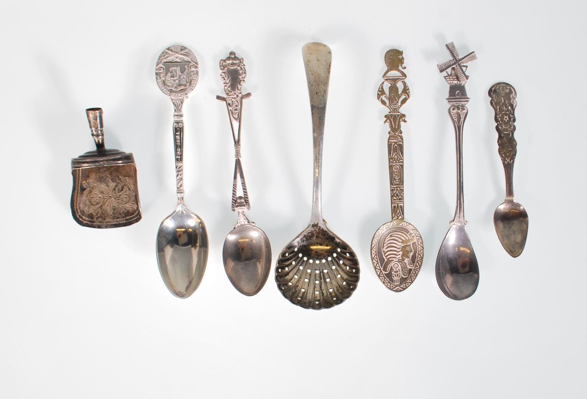 A selection of 20th Century silver spoons to include a a golfing related spoon with handle in the