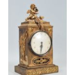 An early 20th Century brass mantel clock of uprigh