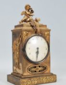 An early 20th Century brass mantel clock of uprigh