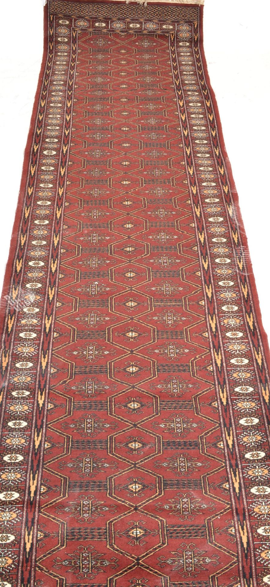 A collection of  20th century rugs to include a large red ground Persian runner with geometric - Image 4 of 7