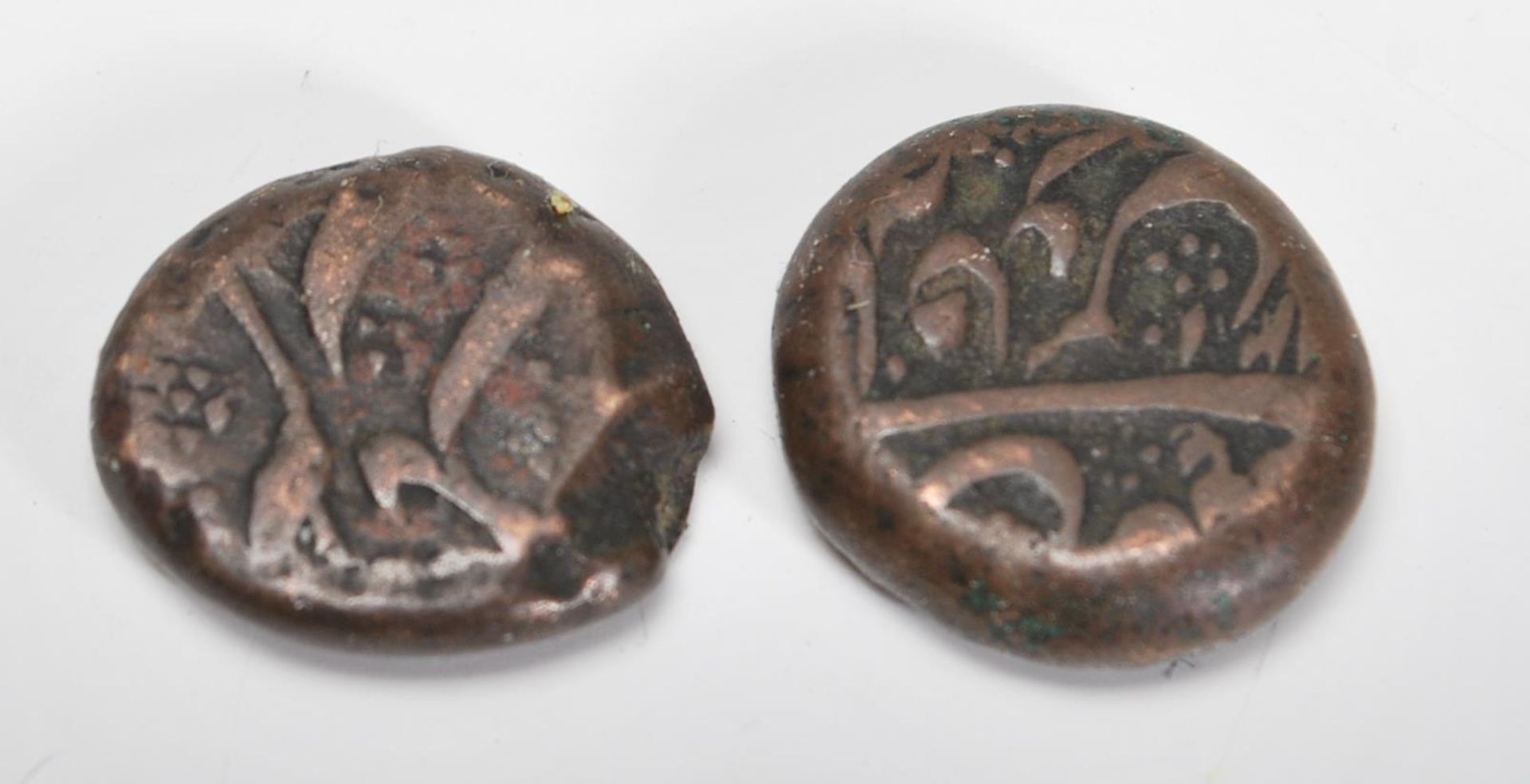 Two 18th century Indian Copper coins believed to be Princely State. Each with broad swords, one