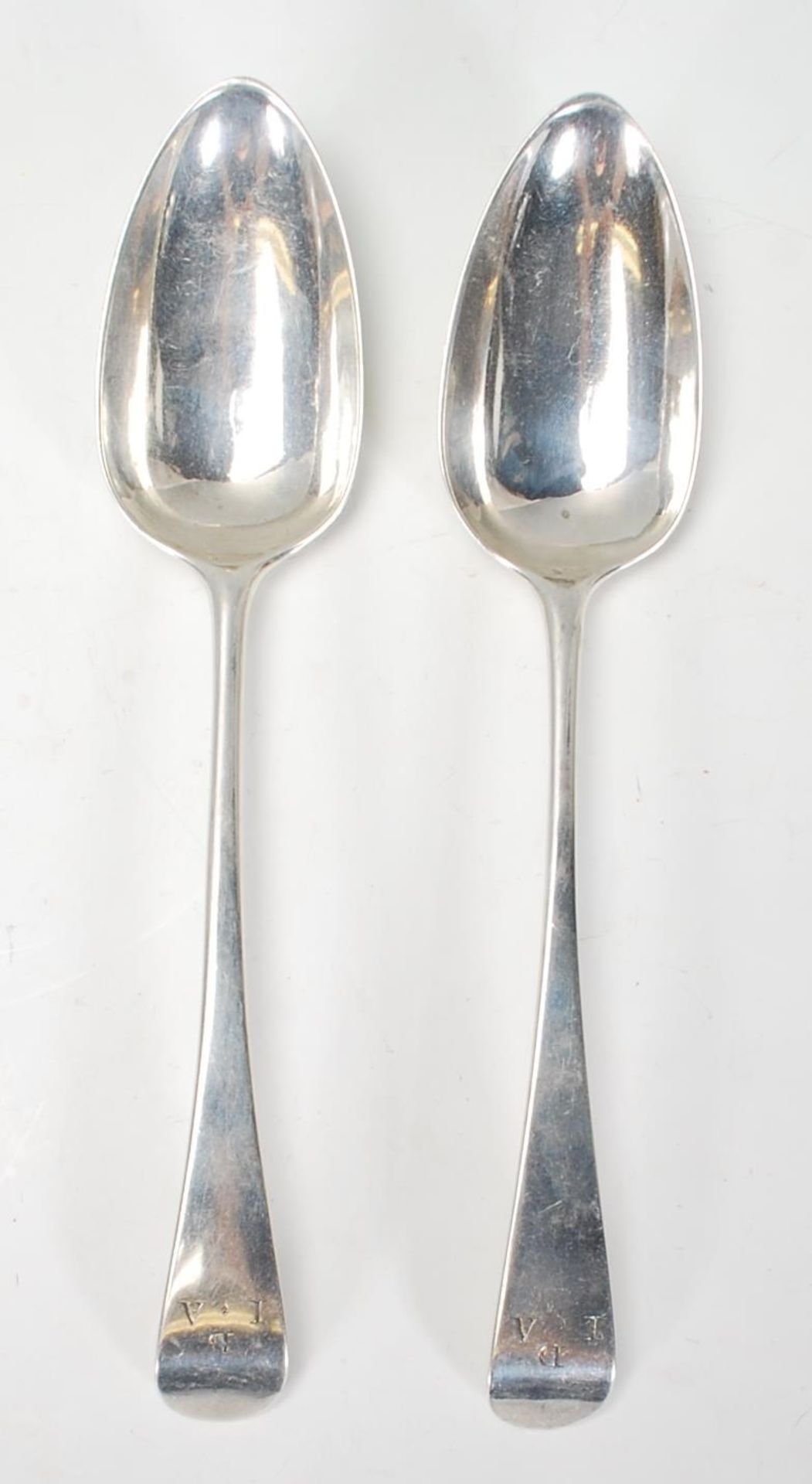 A pair of early 19th Century George III Alice and George Burrows silver hallmarked serving spoons