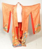 A vintage mid 20th Century 1950's Japanese silk Kimono. Orange ground having embroidered floral