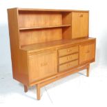 A 20th Century retro teak wood highboard sideboard credenza, having a configuration of three central