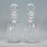 A pair of Waterford crystal cut glass decanters in the Colleen pattern, having faceted bulbous