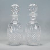 A pair of Waterford crystal cut glass decanters in the Colleen pattern, having faceted bulbous