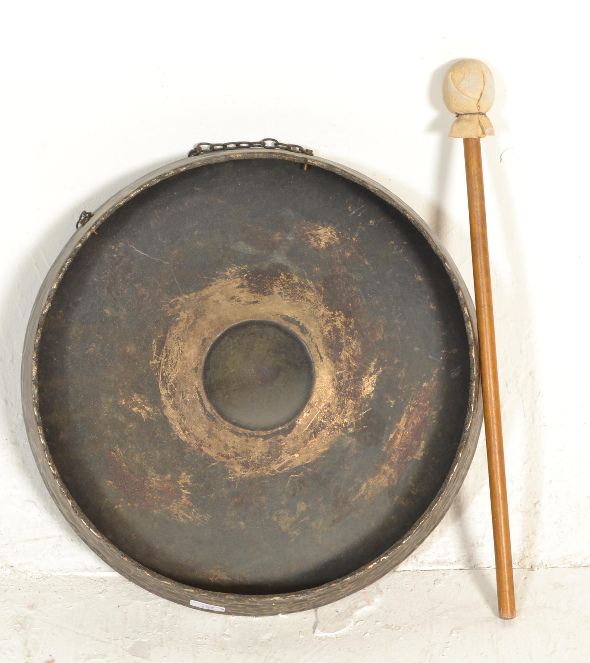 A large early 20th century planished brass gong of roundel form together with the associated - Image 4 of 4