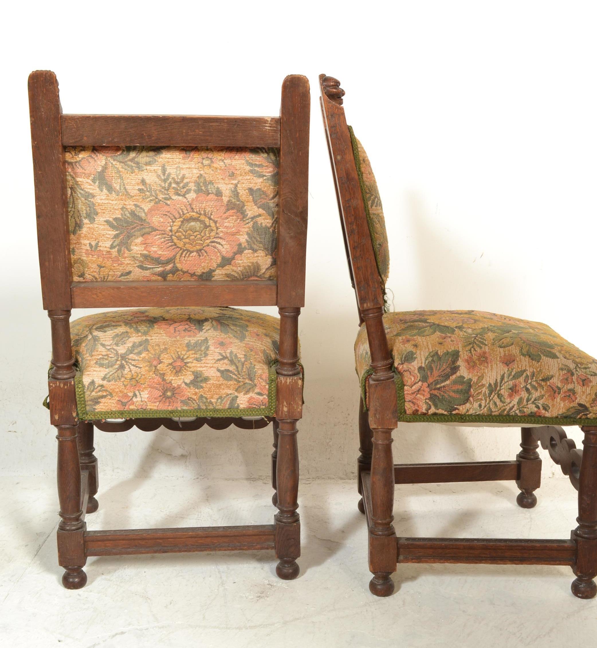 A set of 4 Victorian 19th century carved oak and tapestry upholstered dining chairs. Raised on - Image 4 of 4