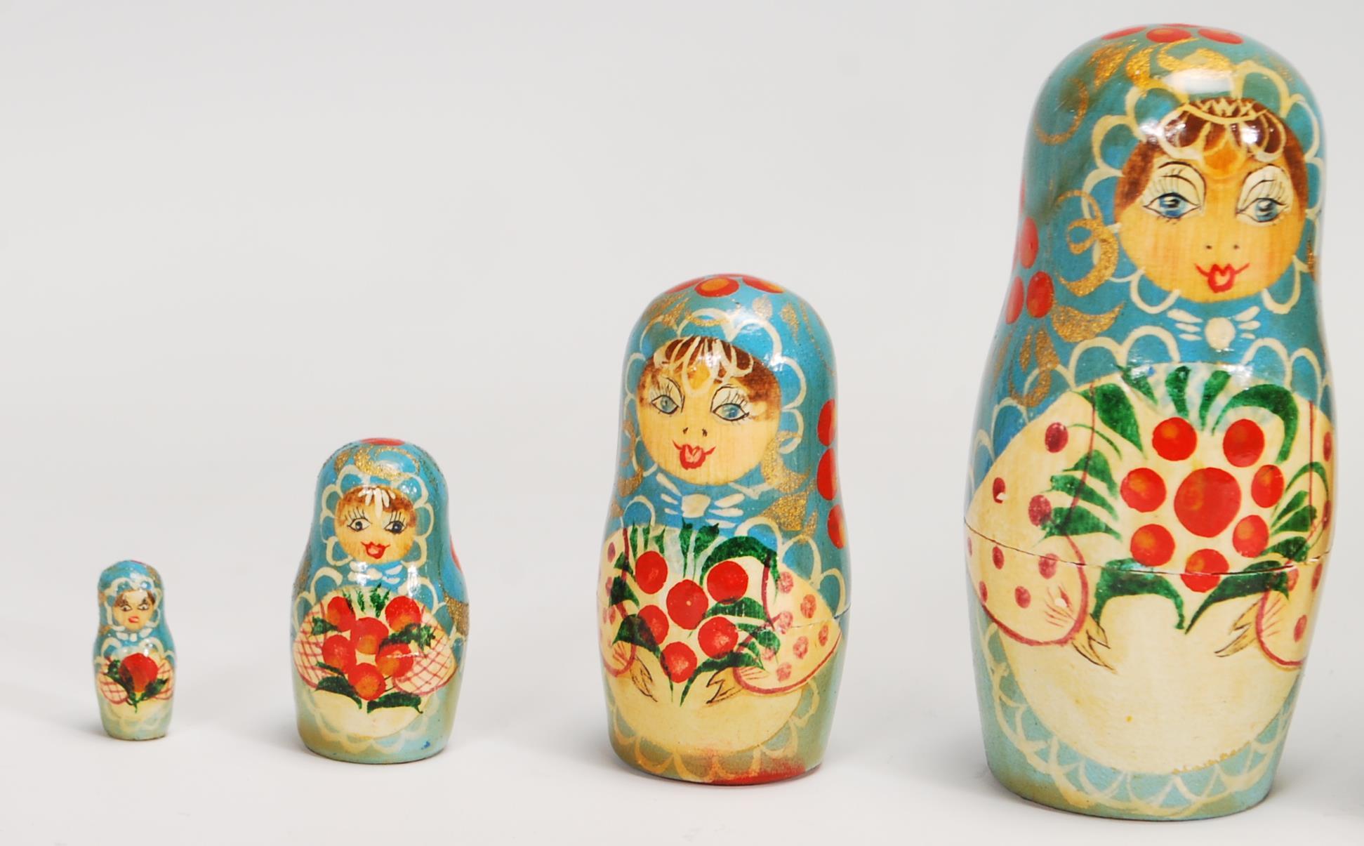 A collection of Russian ornaments to include a large set of russian dolls beung hand painted with - Image 9 of 9