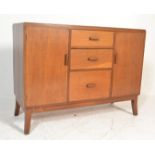 A mid 20th Century oak sideboard credenza having a central bank of three graduating drawers