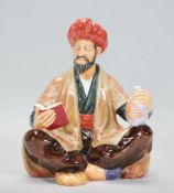 A Royal Doulton figurine ornament 'Omar Khayyam' HK 2247 in the form of a seated male figure.