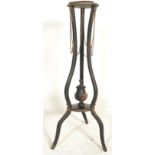 A 19th century Victorian  ebonised adams revival plant stand torchere. The circular plinth over