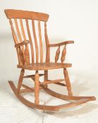 A good quality Windsor rocking chair / armchair. Of beech wood construction having turned legs on