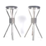 A pair of 20th Century retro vintage industrial workbench / bar stools of polished metal