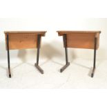 A pair of vintage mid 20th Century school desks, plank top with lift up flap to rear with storage