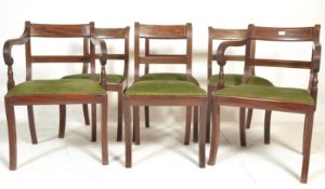 A set of 6 Regency revival mahogany inlaid dining chairs. Raised on reeded sabre legs with green