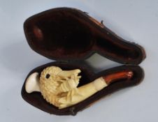 An early 20th Century carved pipe in the from of a ducks head having a small bug on the side with