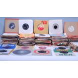 A collection of 45rpm 7" vinyl singles dating from the 1960's featuring various artists and genres