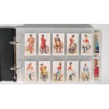 An album of vintage Carreras cigarette cards, full sets to include History of Army Uniforms, Kings