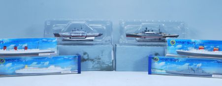 A group of Hornby and Atlas scale model boats. Hornby 1:1200 diecast scale models include RMS