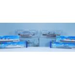 A group of Hornby and Atlas scale model boats. Hornby 1:1200 diecast scale models include RMS