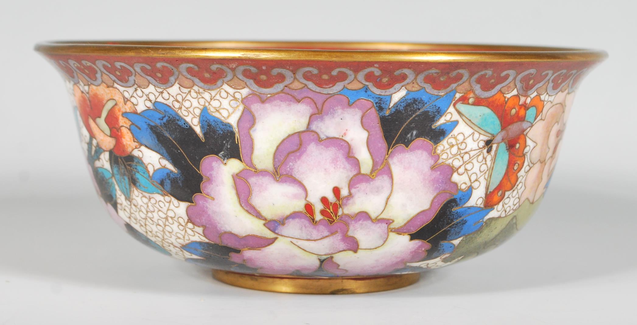 A 20th Century Chinese cloisonne bowl of flared form with a footed base decorated throughout with