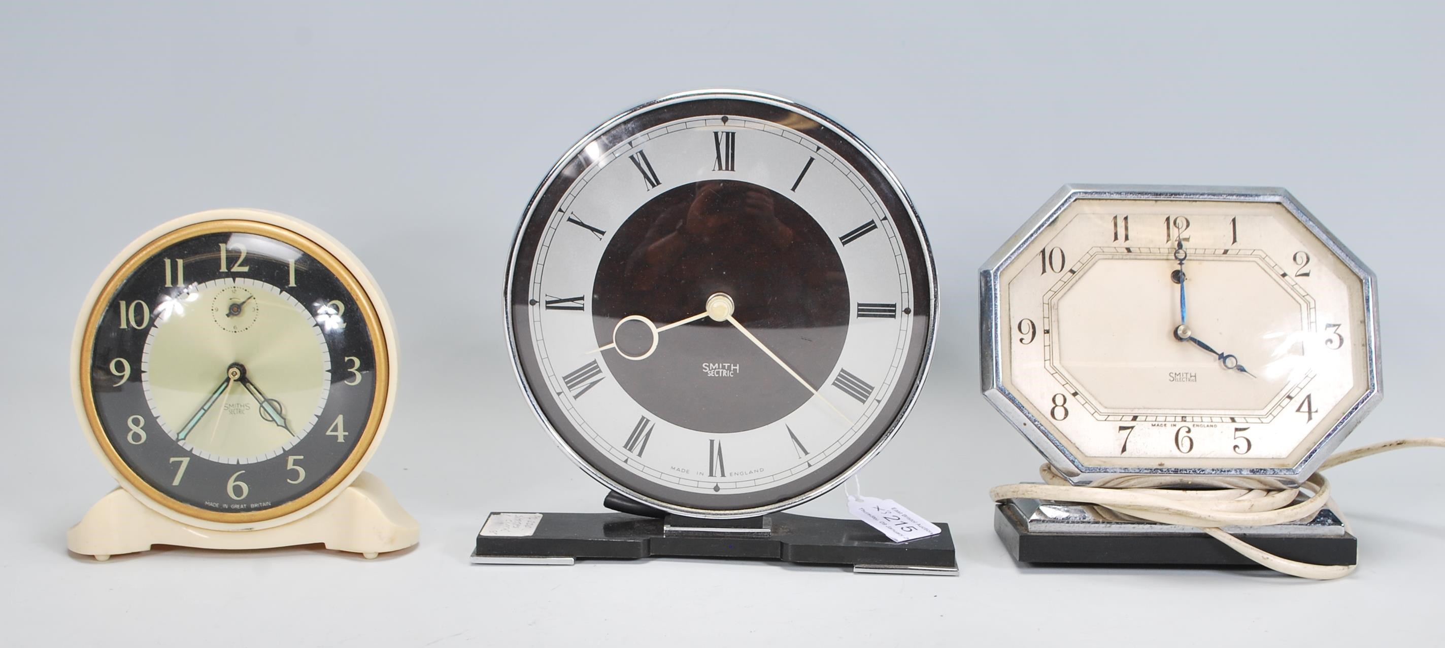 A group of three 20th Century Art deco mantel clocks by Smith Sectric and one Smith Electric. One of