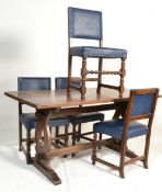 An early to mid 20th century Jacobean revival oak refectory dining table and set of 4 faux leather
