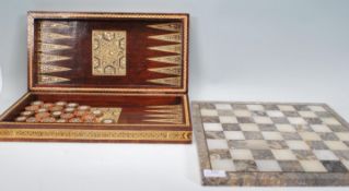 A vintage mid 20th Century eastern games compendium set in checkerboard case having Vizagapatam