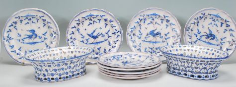 A group of French Faience plates each having a white ground with hand painted blue bird decoration