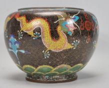 An early 20th Century Chinese Cloisonne brass and copper vase / planter having an enamelled black