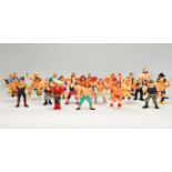 A collection of 1990's toy Titan sports wrestling action figures to include a wide selection of