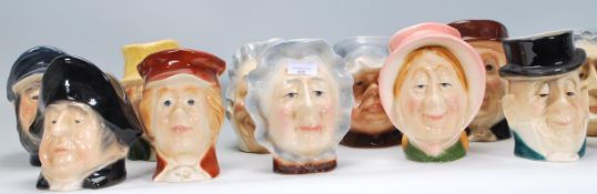 A collection of 20th Century Kingston pottery character jugs from the Charles Dickens series. Twelve