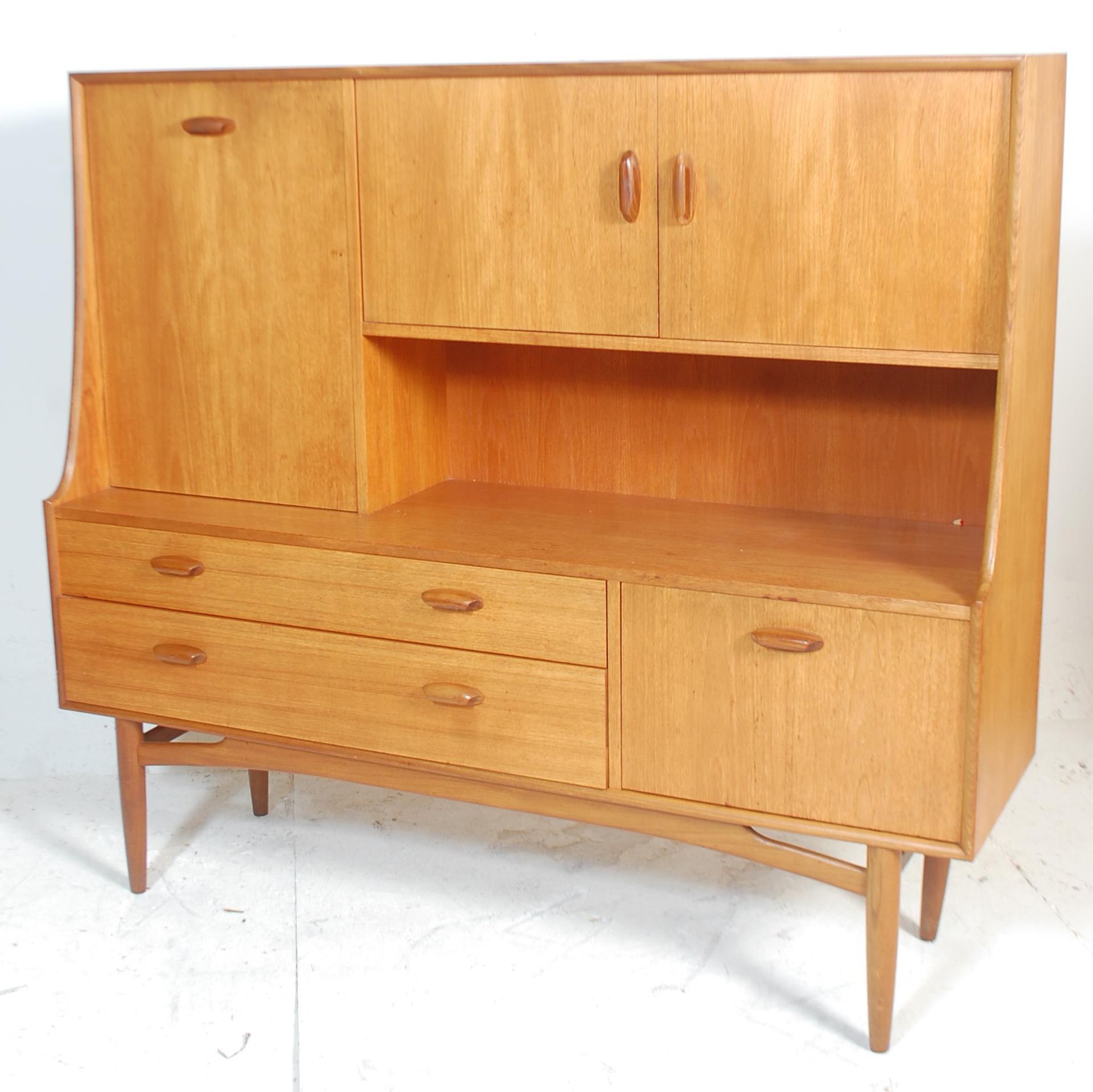 Brasilia - A retro 20th Century teak wood G-Plan highboard sideboard credenza, being raised on - Bild 6 aus 6