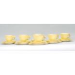 A vintage 20th Century Royal Winton hand painted tea service in the Petunia pattern having yellow