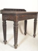 A Victorian 19th century carved oak console table. Of solid oak construction, raised on square