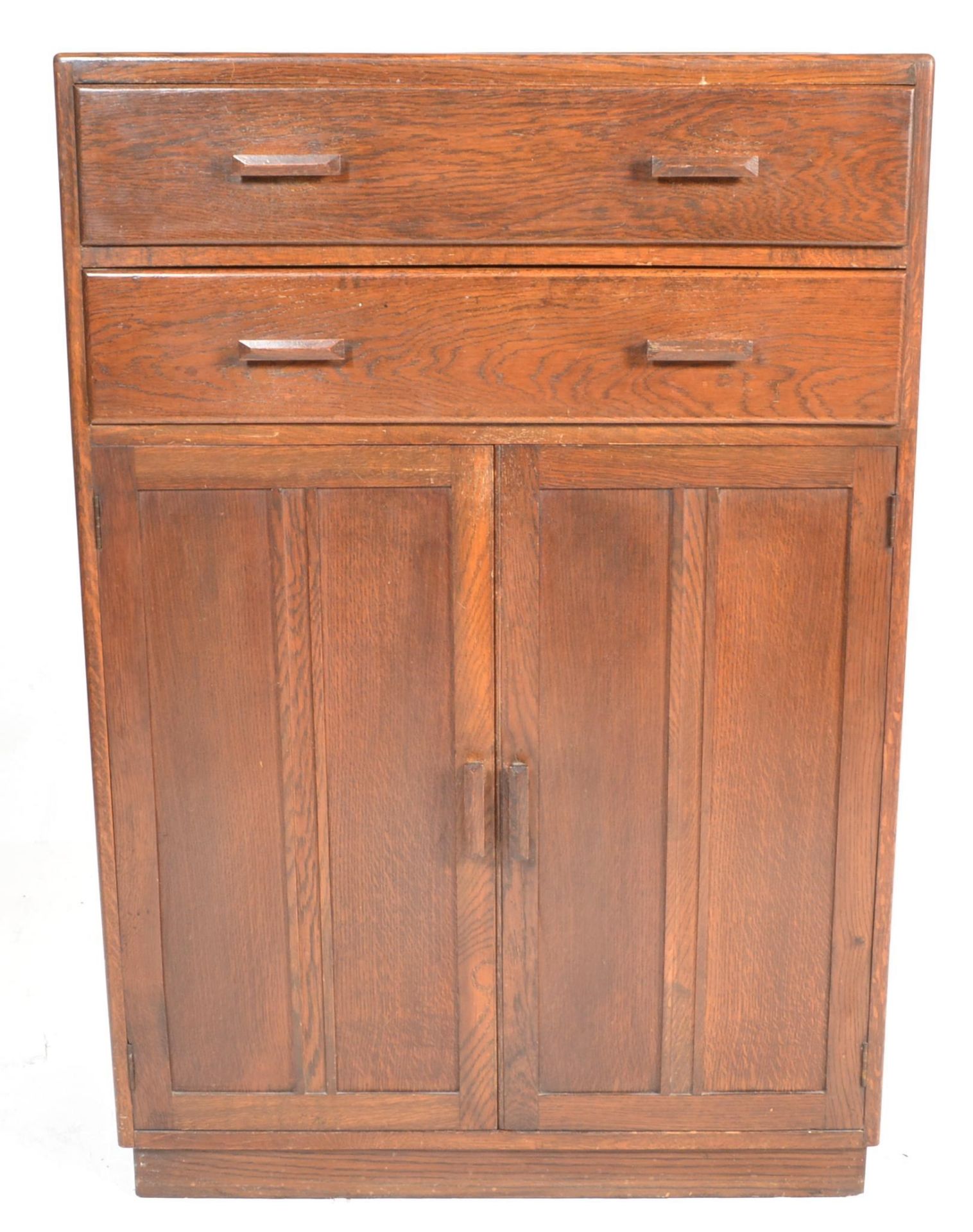 A mid century circa 1940's oak tallboy raised on a plinth base with twin cupboard and two drawers - Bild 2 aus 6