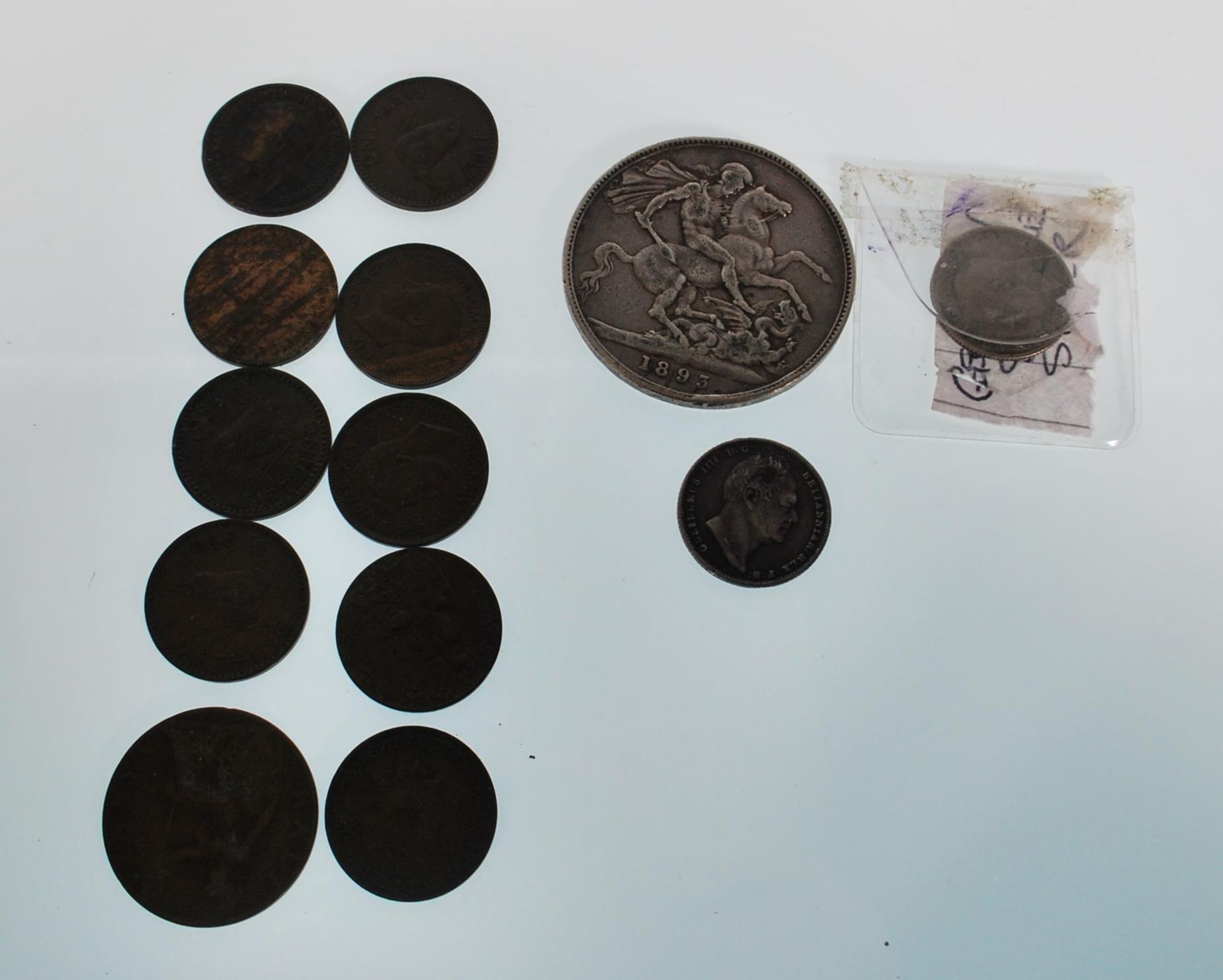 A collection of coins dating from the 19th Century to include an 1893 silver crown with an old