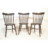 A set of three vintage 20th Century  bistro / dining chairs, shaped back rest over turned spindle